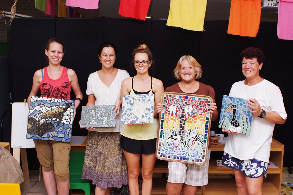 Jabiru Art and Craft Group members Danielle Hore, Lana Davis, Clancy Allen, Lise Seini and Karen Beare with their mosaic works.