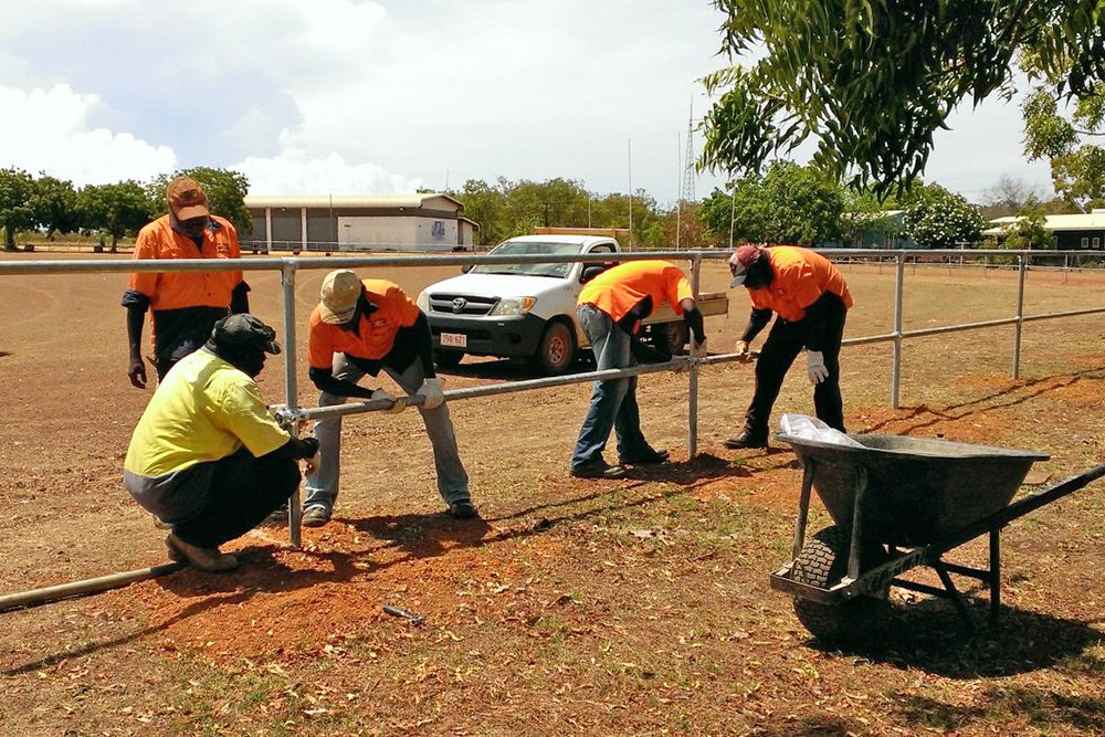 Working on the West Arnhem Regional Council fencing project at Warruwi Oval are (left to right) Richard Narwirr (crouching), Terry Nami, Mickey Yalbarr, Jason Mayinaj and Albert Naruraidj.